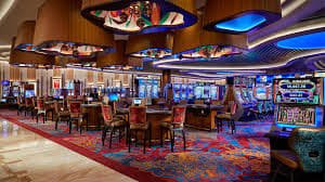 Tata letak roda Live Roulette dengan angka, warna merah dan hitam, dan tombol taruhan di antarmuka dewasloto